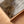 Close-up detail of Coastal Serenity canvas print, warm sienna and ocean tones, DT Art Studio.