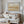 Over The Hills limited edition landscape paper print in black frame above timber console in elegant cream living room – abstract landscape wall art DT Art Studio.