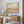 Over The Hills abstract landscape canvas print in oak floating frame above timber sideboard – limited edition wall art DT Art Studio.