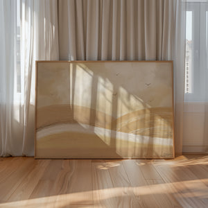 Over The Hills limited edition landscape paper print in oak frame leaning against sheer curtains in sunlit room – abstract golden hills wall art DT Art Studio.