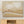 Over The Hills abstract landscape canvas print in black floating frame above timber sideboard with dried flowers – DT Art Studio.