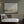 Harmony's Promise abstract landscape canvas print in black floating frame styled in moody olive living room