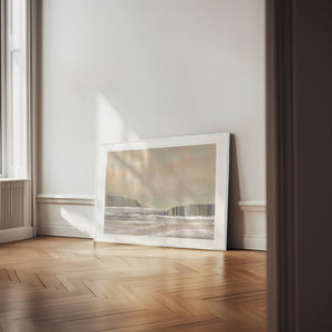 Ocean Bloom limited edition paper print in white frame leaning against wall – abstract Australian coastal wall art DT Art Studio.