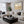 Over The Hills limited edition landscape paper print in black frame above cream sectional sofa in contemporary living room – abstract wall art DT Art Studio.