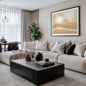 Over The Hills limited edition landscape paper print in black frame above cream sectional sofa in contemporary living room – abstract wall art DT Art Studio.