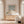 After The Rain abstract coastal paper print in oak frame above timber sideboard in sunlit elegant living room – DT Art Studio.