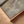 Close-up of Whispers of Light canvas print in oak floating frame – soft sandy coastal tones, DT Art Studio.