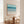Coastal Azure large format canvas print in oak frame styled in bright coastal dining room – DT Art Studio.