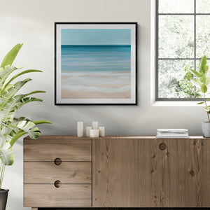 Coastal Azure limited edition paper print in black frame above timber sideboard – abstract seascape wall art DT Art Studio.