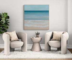 Coastal Azure abstract coastal canvas print in oak floating frame styled in neutral living room – DT Art Studio.