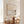 Unbound limited edition coastal canvas print in oak frame styled in bright dining room – Australian wall art