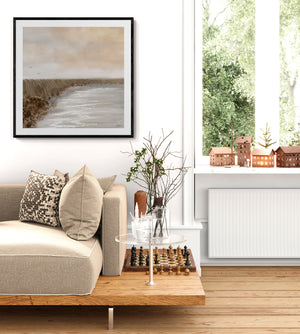 Coastal Serenity limited edition paper print in black frame styled in bright Scandinavian living room – Australian coastal wall art DT Art Studio.