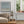 After The Rain abstract coastal paper print in black frame styled in Scandinavian living room – limited edition wall art DT Art Studio.