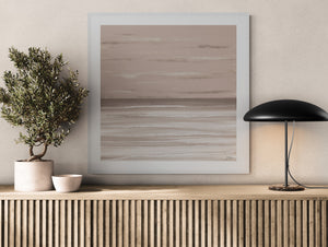Dusk limited edition paper print in white frame above slatted timber sideboard with olive tree – abstract coastal wall art DT Art Studio.