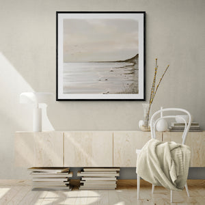 Unbound limited edition paper print in black frame above cream sideboard in minimalist living room – abstract coastal wall art DT Art Studio.