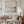 Unbound abstract seascape canvas print in oak floating frame styled in neutral living room – DT Art Studio.